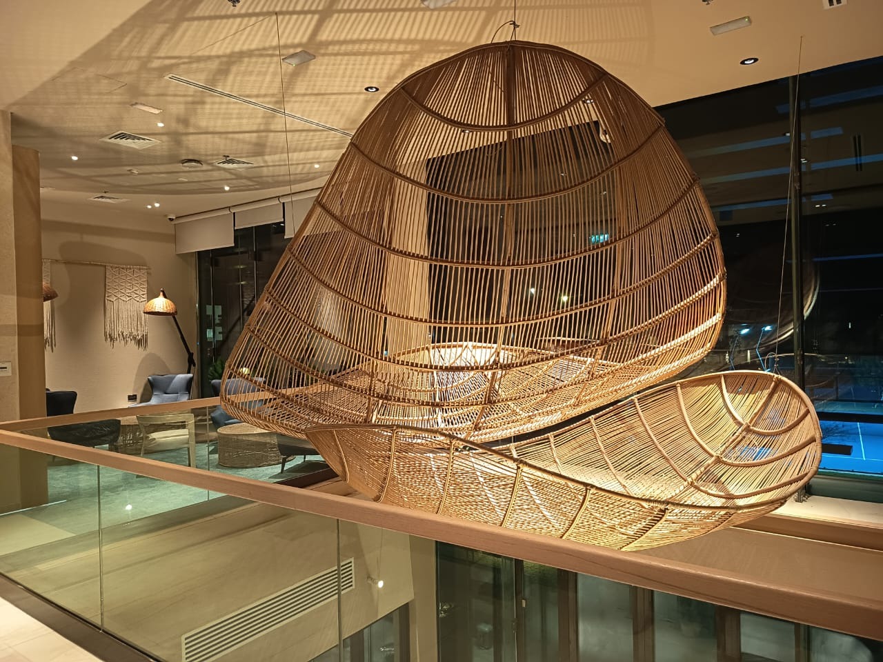 Interior featuring a large woven suspended sculpture