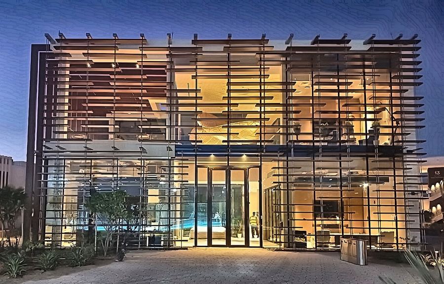 Illuminated timber-fin facade at dusk