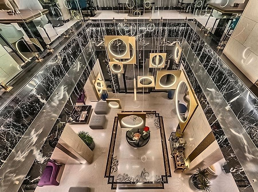 Atrium seen from above with sculptural ring pendants