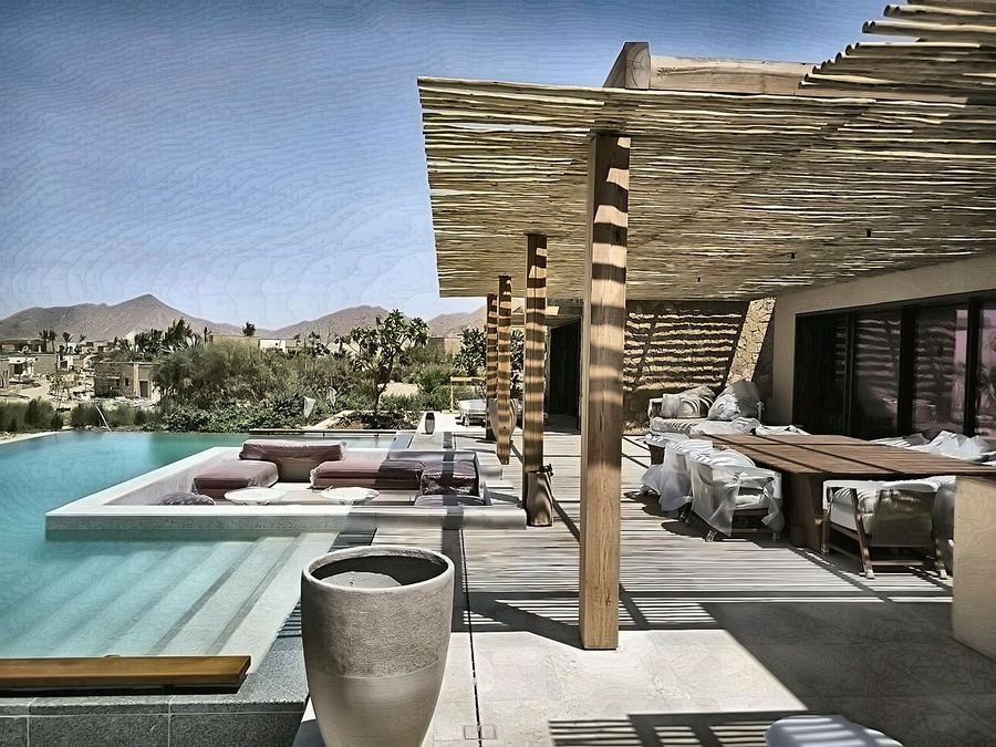 Desert villa terrace with a shaded pergola and pool